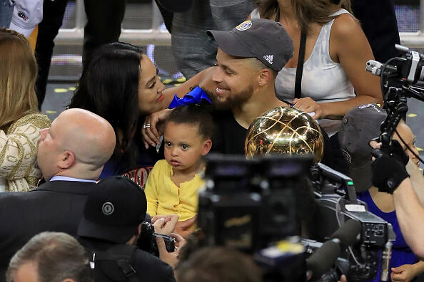 OAKLAND, CA - JUNE 12:  Stephen Curry #30 of the Golden State Warriors celebrates with his wife Ayesha after defeating the Cleveland Cavaliers 129-120 in Game 5 to win the 2017 NBA Finals at ORACLE Arena on June 12, 2017 in Oakland, California. NOTE TO USER: User expressly acknowledges and agrees that, by downloading and or using this photograph, User is consenting to the terms and conditions of the Getty Images License Agreement.  (Photo by Ronald Martinez/Getty Images)