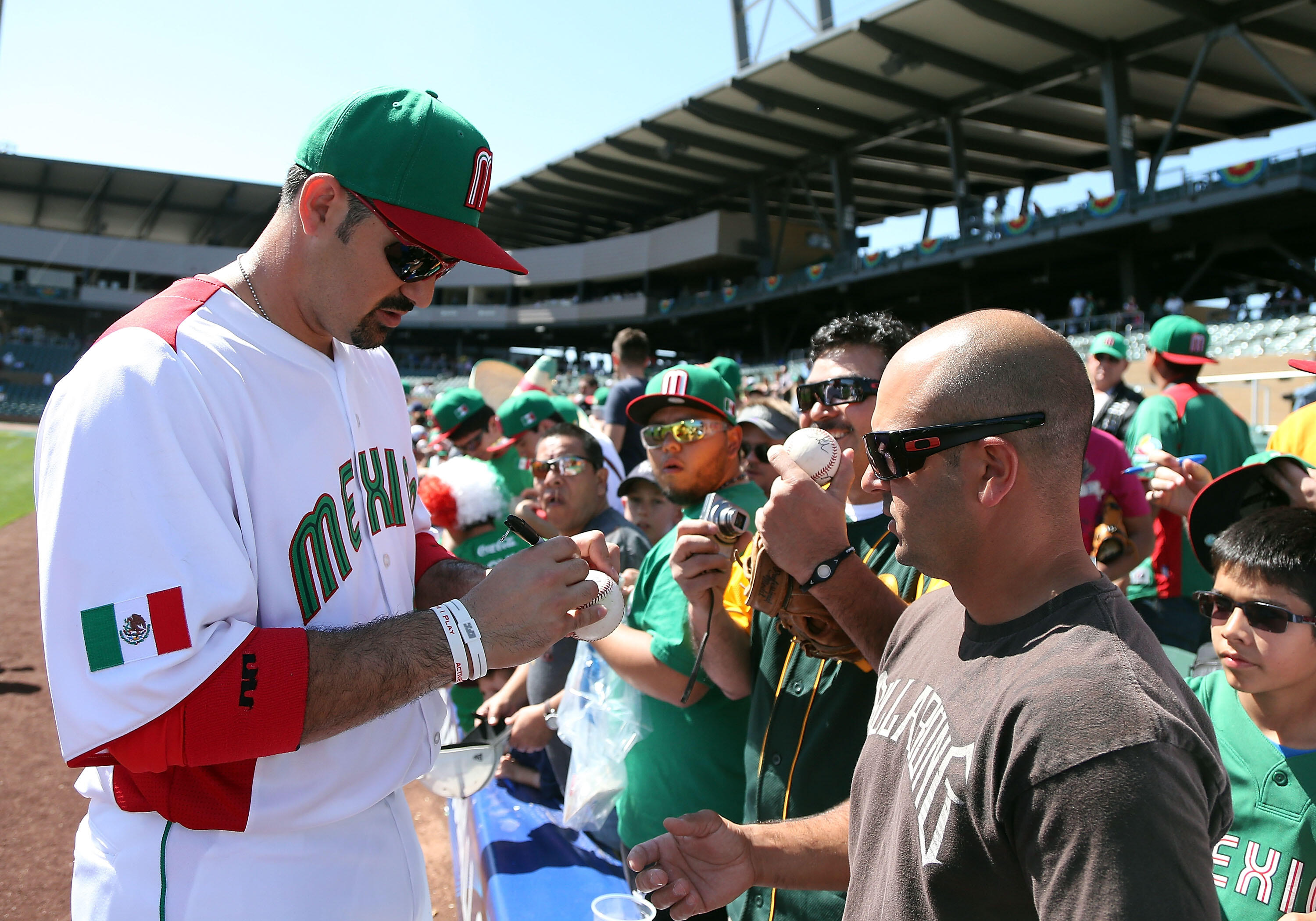 SCOTTSDALE, AZ - MARCH 07:  Adrian Gonzalez #23 of Mexico signs autographs before the World Baseball Classic First Round Group D game against Italy at Salt River Fields at Talking Stick on March 7, 2013 in Scottsdale, Arizona.   Italy defeated Mexico 6-5.