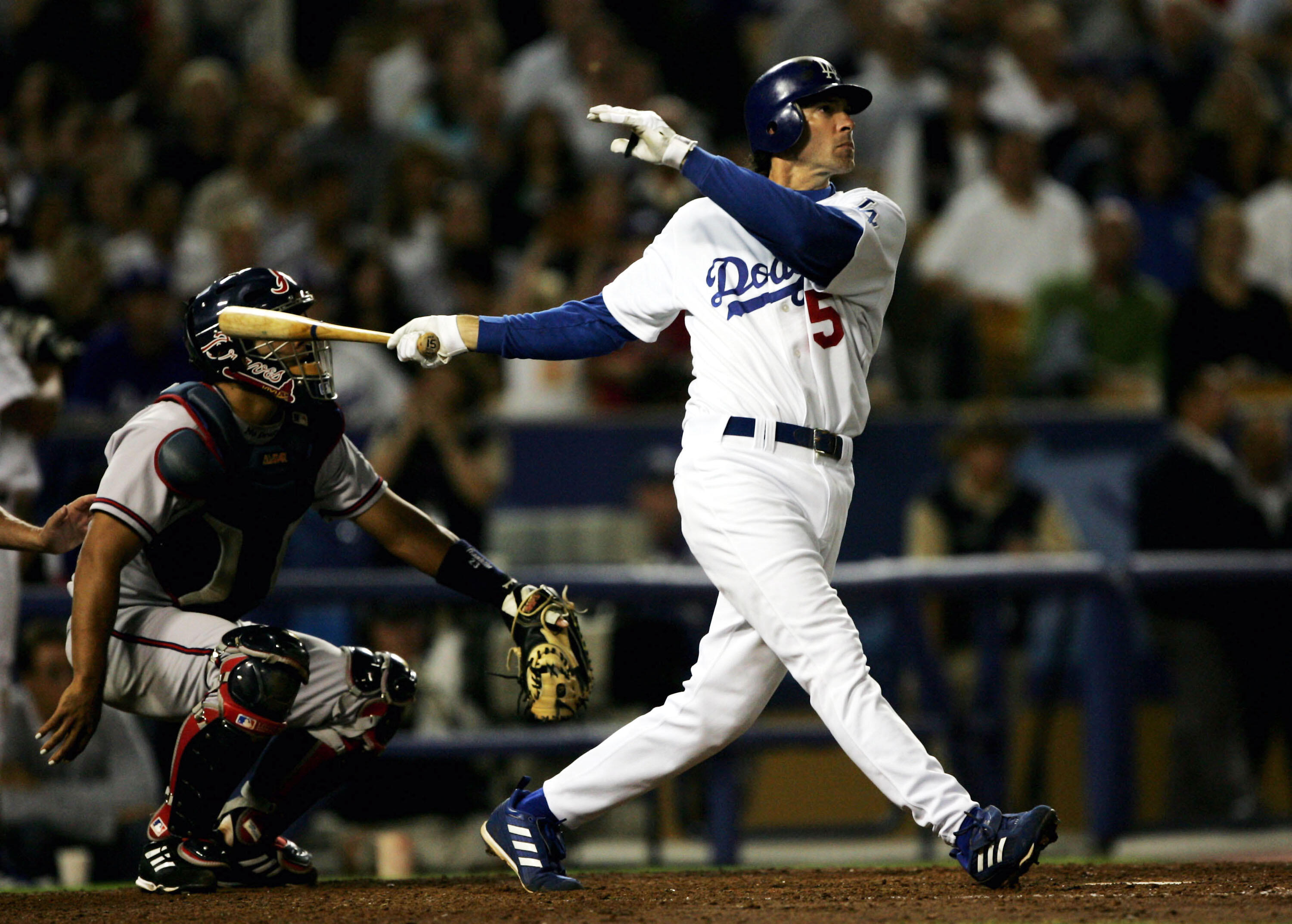LOS ANGELES - AUGUST 19:  Shawn Green #15 of the Los Angeles Dodgers hits his second home run of the game and the second of back to back home runs with Adrian Beltre to tie the score at 5-5 with the Atlanta Braves in the eighth inning on August 19, 2004 a