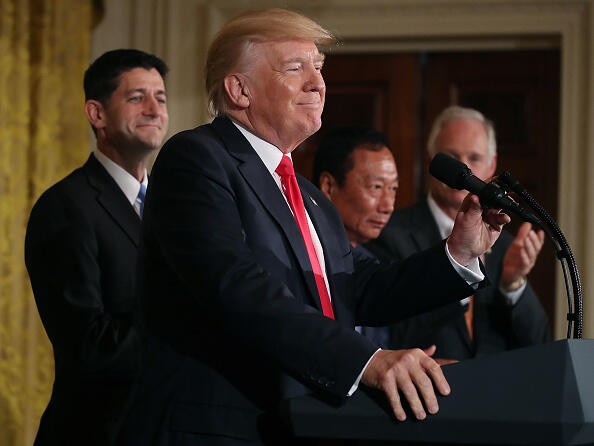 WASHINGTON, DC - JULY 26: US President Donald Trump while flanked by House Speaker Paul Ryan (R-WI) (L), Terry Gou (2ndR), Chairman of Foxconn, an electronics supplier, and Sen. Ben Johnson (R-WI) (R) during an announcement that the company will open a manufacturing facility in Wisconsin, during an event in the East Room of the White House. (Photo by Mark Wilson/Getty Images)
