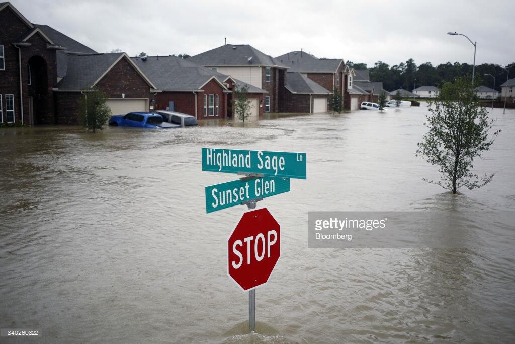 Houses at the Highland Glen subdivision stand in flood waters due to Hurricane Harvey in Spring, Texas, U.S., on Monday, Aug. 28, 2017. A deluge of rain and rising floodwaters left Houston immersed and helpless, crippling a global center of the oil industry and testing the economic resiliency of a state that's home to almost 1 in 12 U.S. workers. Photographer: Luke Sharrett/Bloomberg via Getty Images