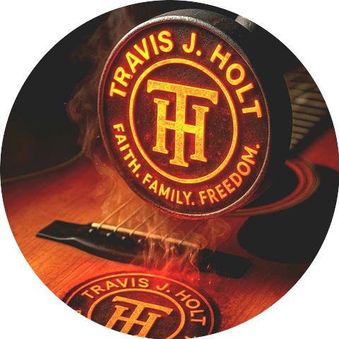 Travis J. Holt