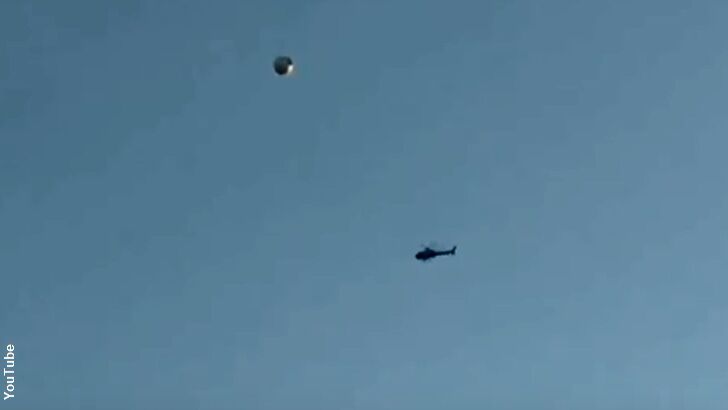 Helicopter Circles UFO Over LA?