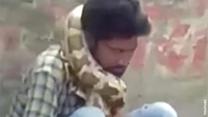 Video: Python Strangles Snake Charmer