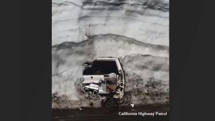 Sliced Snowbank Reveals Buried Jeep
