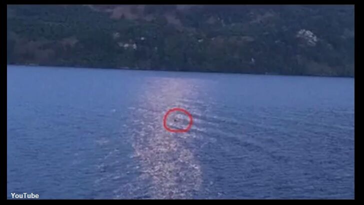 Girl Photographs Moonlit Nessie