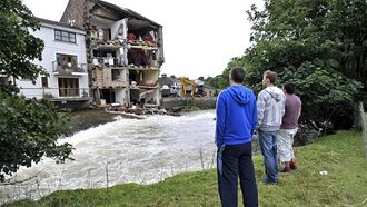 Flood Tears Down Wall