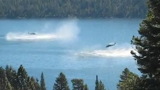 Video: Helicopter Dips Into Lake
