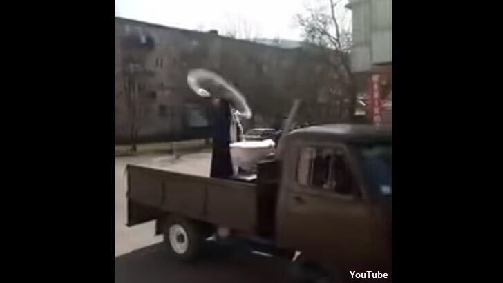 Video: Ukrainian Priest Blesses Streets with Holy Water to Ward Off Coronavirus