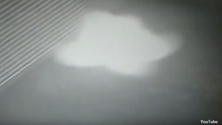 Watch: Security Camera Films Ghost in Parking Garage?