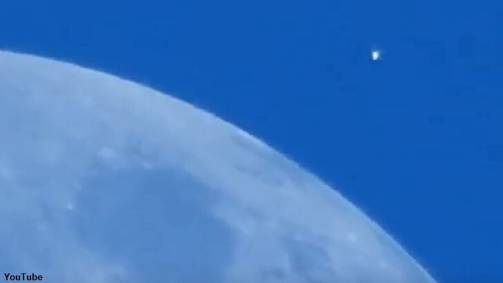 Odd UFO Filmed Flying Past Moon