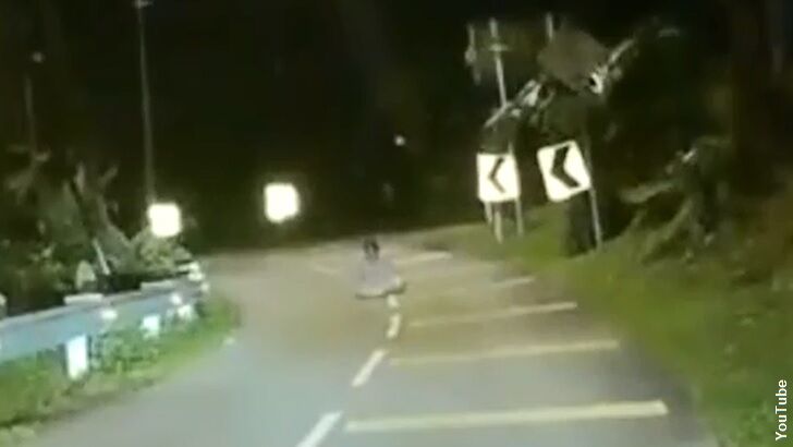 Watch: Dashcam Captures Ghostly Figure Sitting in Road