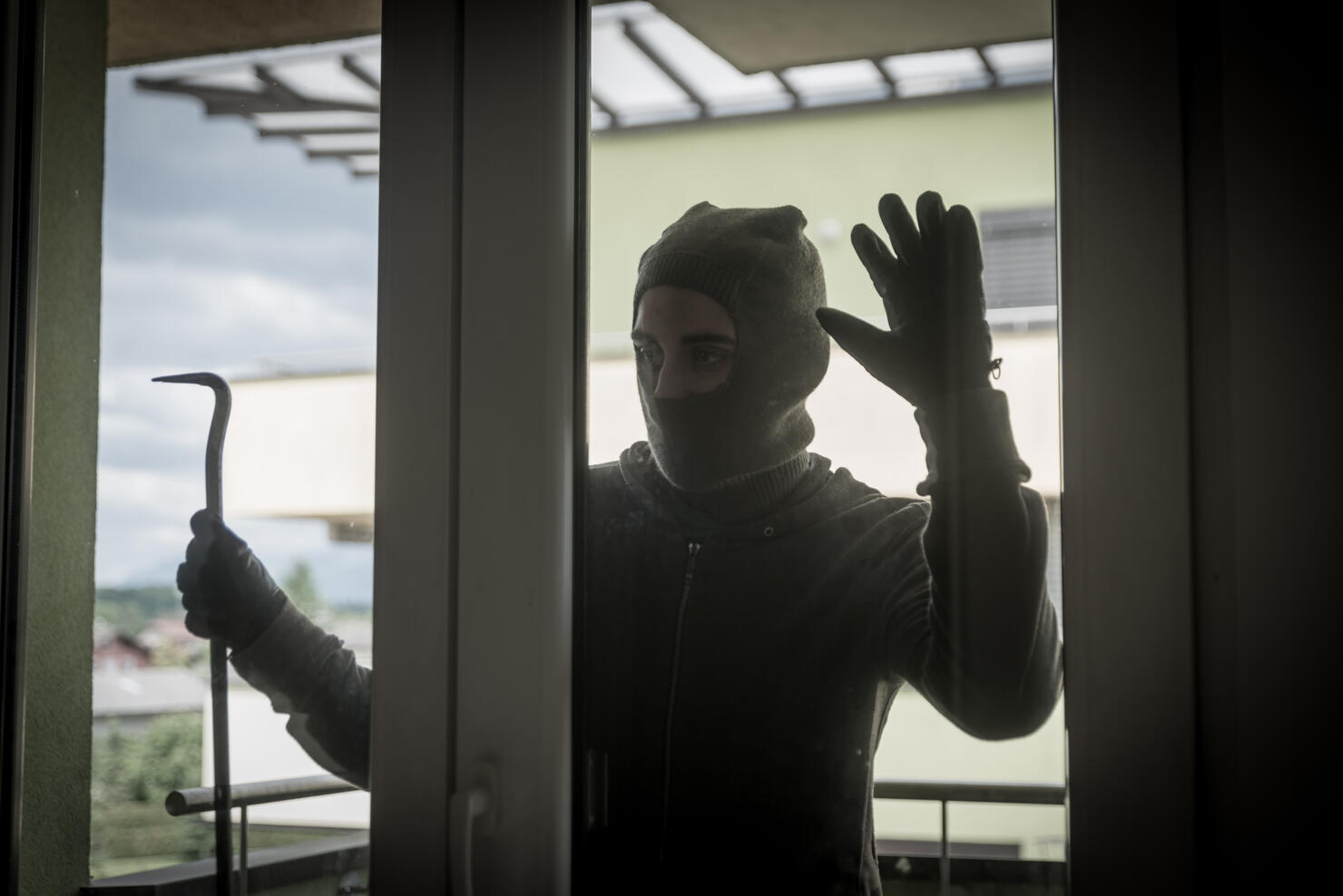 Burglar Breaking Into House