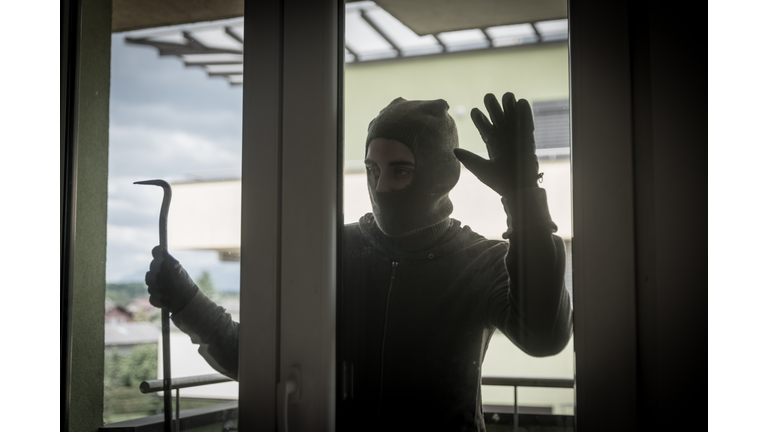 Burglar Breaking Into House