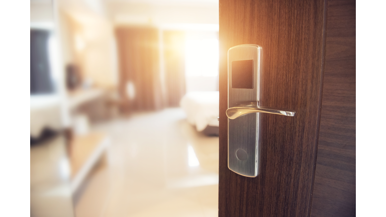 Opened door of hotel room in morning.