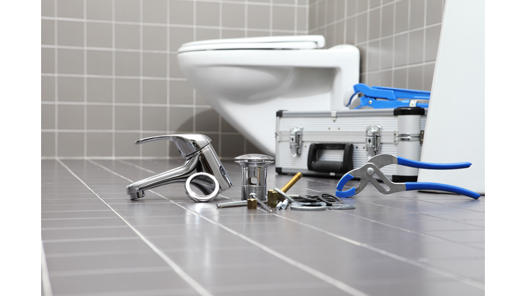 plumber tools and equipment in a bathroom, plumbing repair service, assemble and install concept