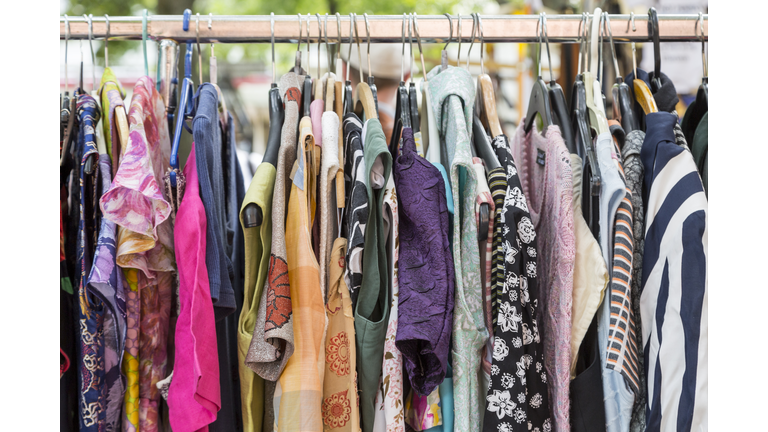 clothes on a rack on a flea market