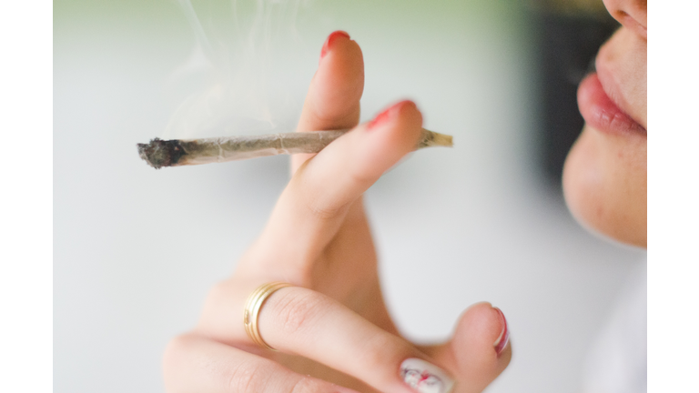 Close-Up Of Woman Smoking Weed