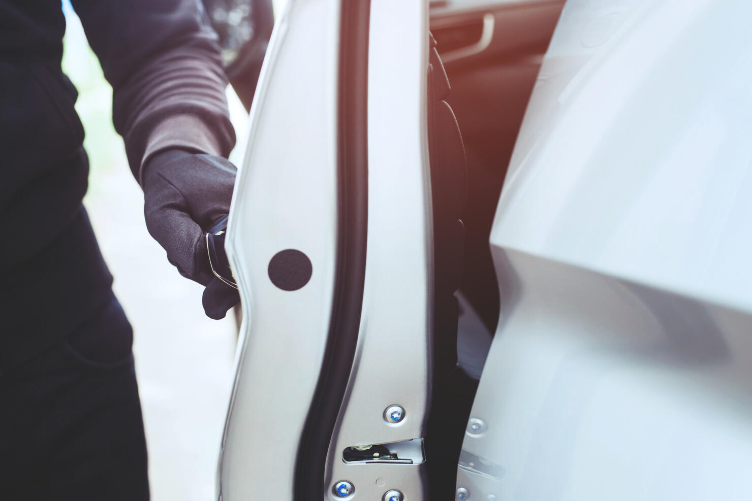 Midsection Of Thief Opening Car