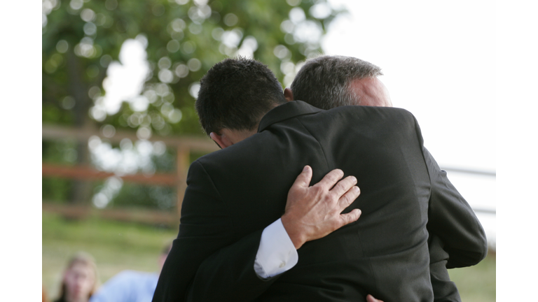 Loving Hug Between Friends / Father and Son