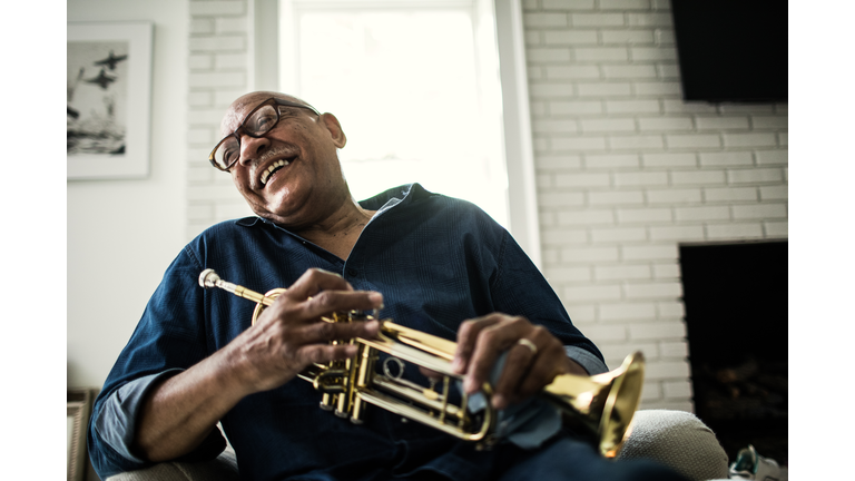 Portrait of senior man with trumpet