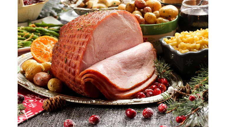 Holiday baked Ham with sides  / Xmas Dinner  table setting, selective focus