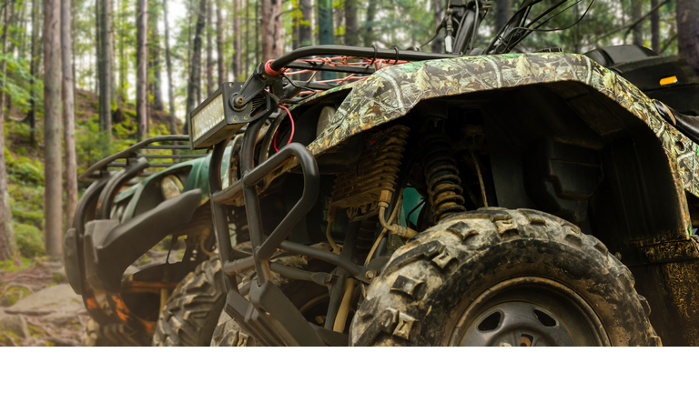 Camouflaged hunting offroad atv vehicles.
