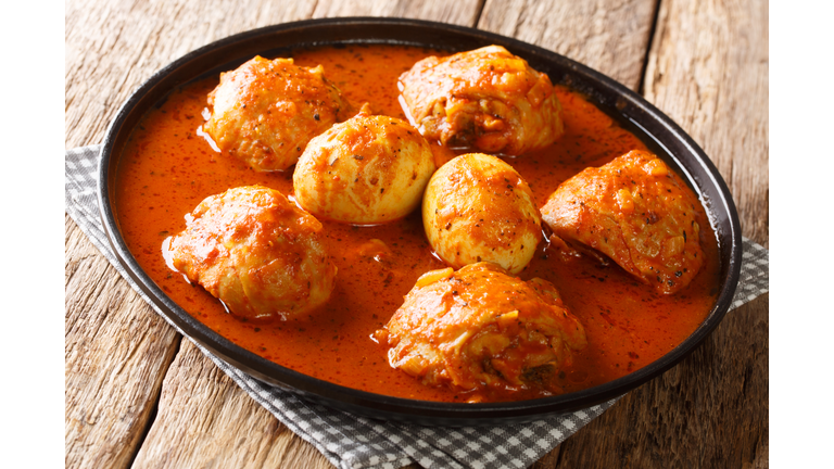 Doro Wat Ethiopian Chicken Stew slowly simmered in a blend of robust spices close-up in a plate. Horizontal