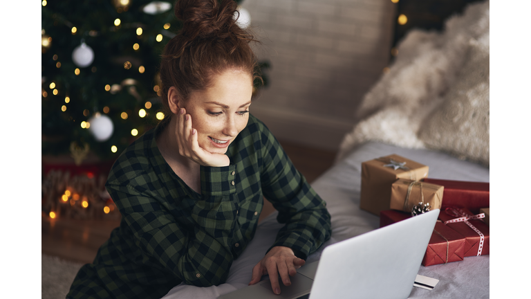 Woman shopping for Christmas presents online