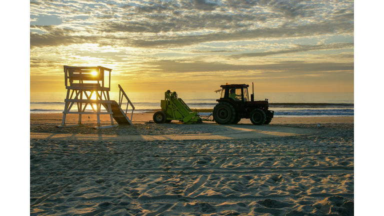 Tractor Raking the Beach near a Life Guard Tower on the Jersey Shore