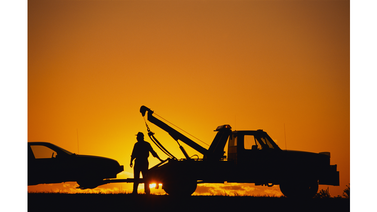 Tow Truck Operator at Sunset