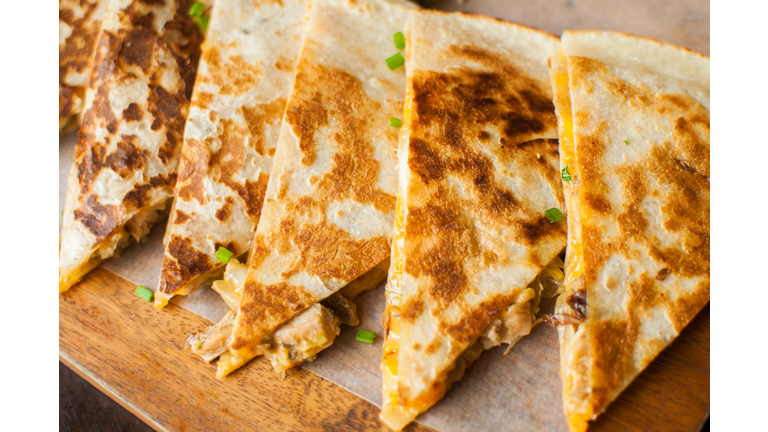 Cheese quesadilla gourmet on a wooden table