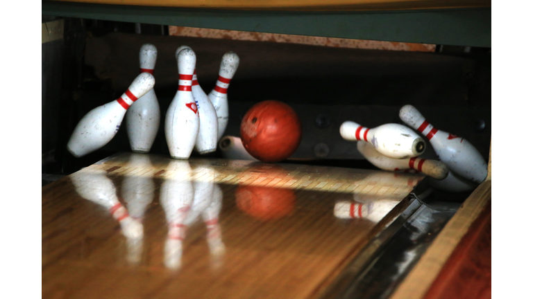 Close up of Bowling Ball hitting the Pins at a Bowling Alley