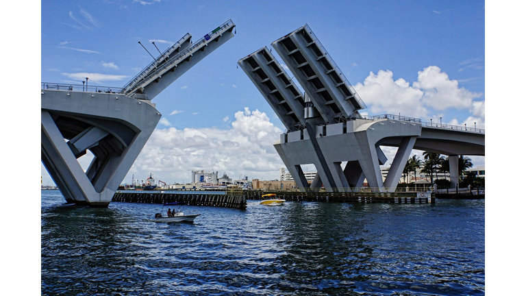 Drawbridge Over Sea Against Cloudy Sky
