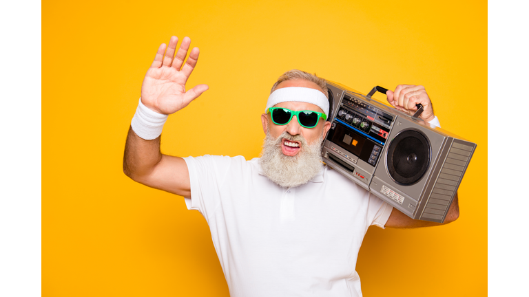 Yeah bro! What`s up? Cheerful excited aged funny sexy gangster cool grandpa dude in eyewear with bass clipping ghetto blaster recorder. Old school, swag, fooling, gym, technology, success, hip hop