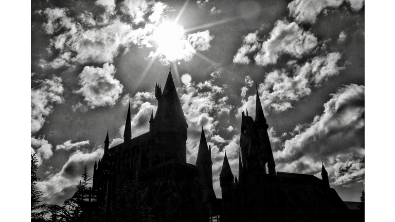 Low Angle View Of Hogwarts Castle Against Cloudy Sky At Harry Potter Theme Park