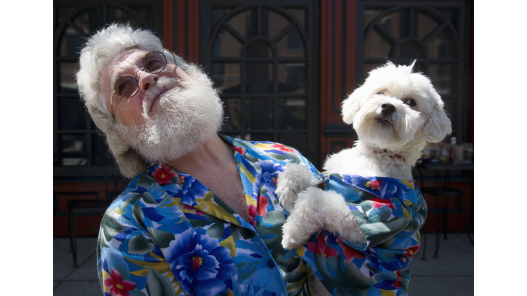 Senior man with look alike dog.