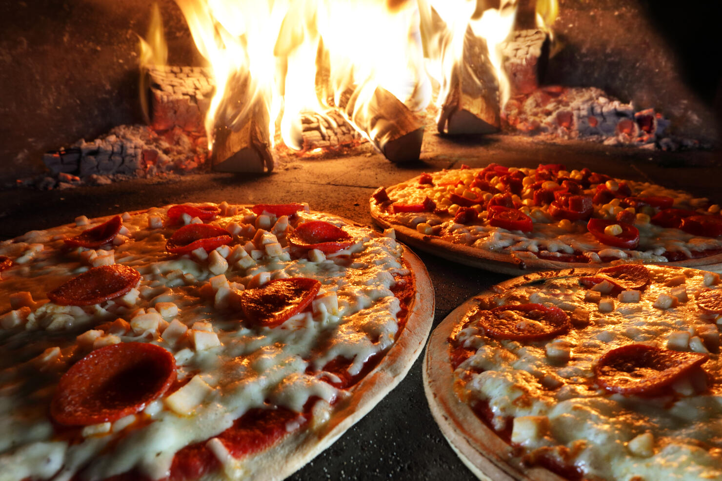 Pizzas in pizza oven