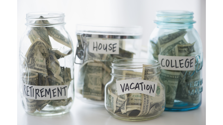 Close up of savings jars with money