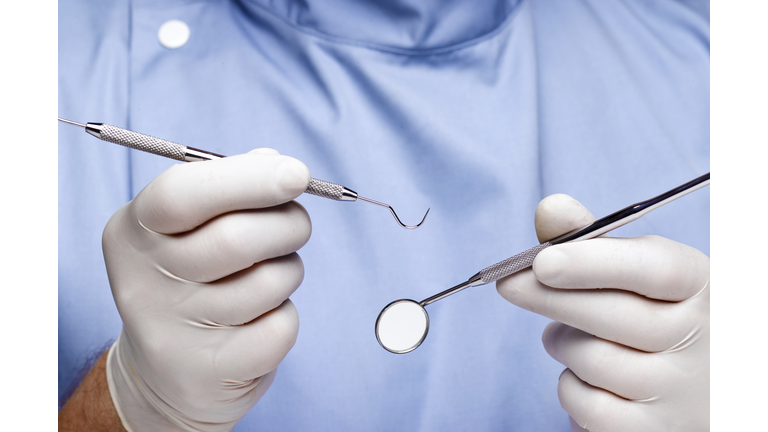 Dentist doing dental examination