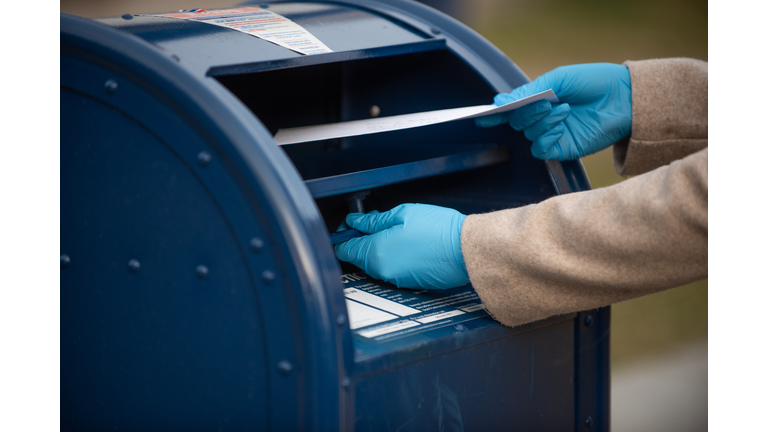 Close Up Of A Person Mailing A Letter