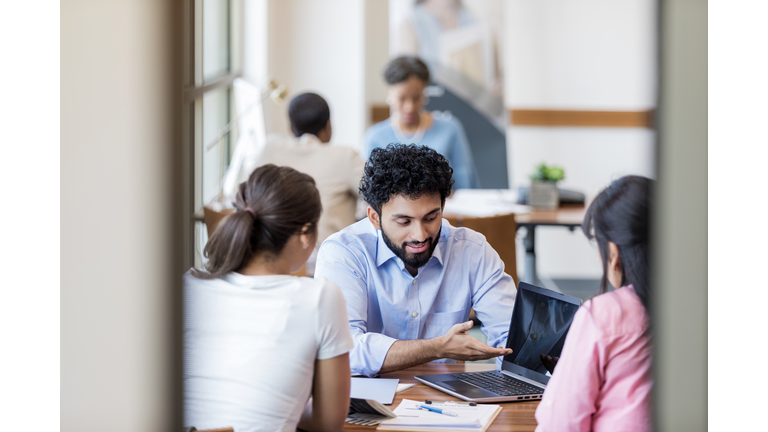 Loan officer meets with college student about a student loan