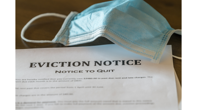 Official legal eviction order or notice to renter or tenant of home with face mask