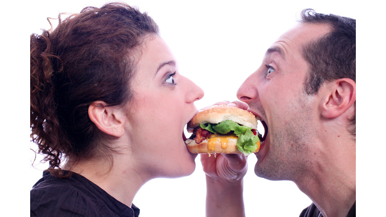 People eating juicy burger