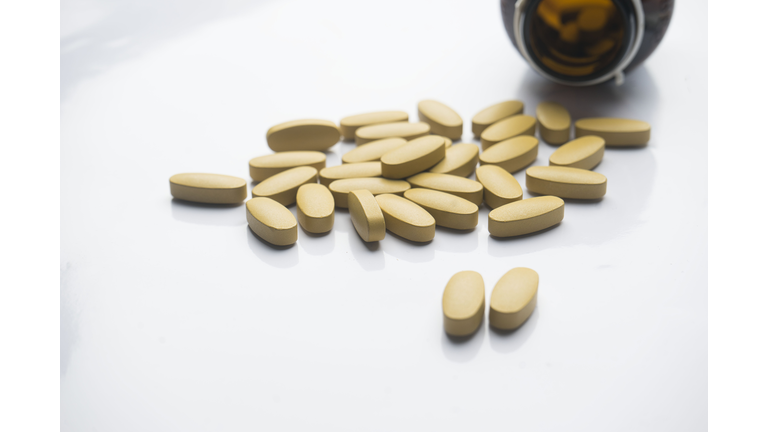 dietary supplement tablet and Vitamin tablet Medicine (pharmacy) and bottle  on white background