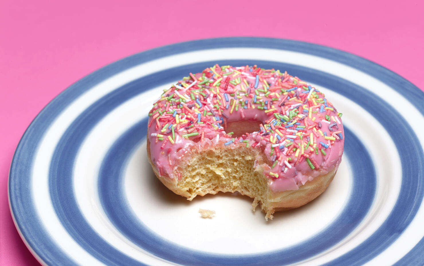 PINK DOUGHNUT ON PLATE