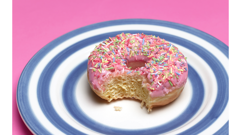 PINK DOUGHNUT ON PLATE