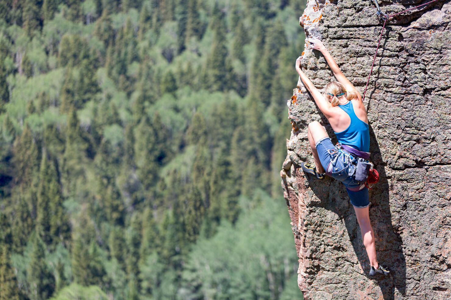 Female Mountain Climber on a Rock Face