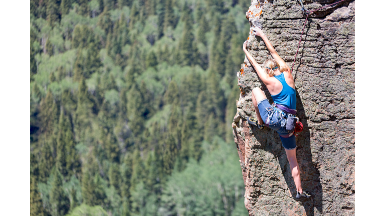 Female Mountain Climber on a Rock Face