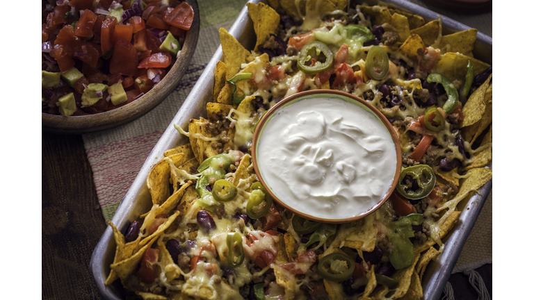 Baked Nachos Tortilla Chips with Salsa, Minced Meat and Jalapenos